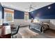 Comfortable bedroom boasting bright windows, ample natural light, and a ceiling fan at 417 Westbury Dr, Chapel Hill, NC 27516