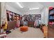 Spacious walk-in closet with custom shelving, ample storage, and center ottoman at 417 Westbury Dr, Chapel Hill, NC 27516