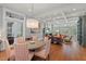 Bright dining area with hardwood floors, coffered ceilings, and a large window view at 417 Westbury Dr, Chapel Hill, NC 27516