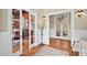 Inviting foyer with hardwood floors and glass-paned doors leading to other rooms at 417 Westbury Dr, Chapel Hill, NC 27516