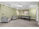 Fun game room with a table tennis setup, comfortable seating, and modern lighting at 417 Westbury Dr, Chapel Hill, NC 27516