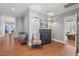 Hallway with hardwood floors, decorative sconces, and views into other rooms at 417 Westbury Dr, Chapel Hill, NC 27516
