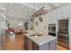 Open kitchen with stainless steel appliances, granite countertops, and a view to the dining area at 417 Westbury Dr, Chapel Hill, NC 27516