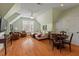 Inviting living room featuring hardwood floors, a comfortable seating area, and a bright window at 417 Westbury Dr, Chapel Hill, NC 27516