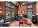 Cozy home office with custom woodwork, natural light, and a comfortable seating area at 417 Westbury Dr, Chapel Hill, NC 27516