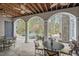 Inviting outdoor patio with stone flooring, ceiling fans, and views of the backyard pool at 417 Westbury Dr, Chapel Hill, NC 27516