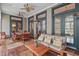 Inviting covered patio with ceiling fans, a dining table, and a comfortable seating area at 417 Westbury Dr, Chapel Hill, NC 27516