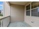 Cozy balcony featuring painted wooden floors and beige siding for a relaxing outdoor space at 452 Panorama Park Pl, Cary, NC 27519