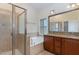 Bright bathroom with a separate tub, shower, double vanity, and stylish finishes at 452 Panorama Park Pl, Cary, NC 27519