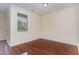 Spacious bedroom with hardwood floors, natural light, and neutral paint for a calming retreat at 452 Panorama Park Pl, Cary, NC 27519
