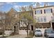 Well-maintained townhome with a brick facade, attached garage, and manicured front yard at 452 Panorama Park Pl, Cary, NC 27519