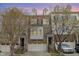 Attractive townhome with brick and siding, a garage, and a well-maintained facade at 452 Panorama Park Pl, Cary, NC 27519
