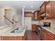 Gourmet kitchen with granite countertops, stainless steel appliances, and cherry wood cabinets at 452 Panorama Park Pl, Cary, NC 27519