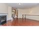 Open-concept living area with hardwood floors, fireplace, and staircase leading to the second floor at 452 Panorama Park Pl, Cary, NC 27519