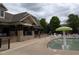 Community pool featuring a mushroom water feature, ample seating, and a nearby clubhouse at 452 Panorama Park Pl, Cary, NC 27519