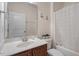 Bathroom featuring a single sink vanity with wood cabinetry and shower-tub combination at 4712 Bright Pebble Ct, Raleigh, NC 27604