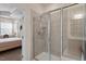 Ensuite bathroom with tiled shower and a view of the Primary bedroom at 4712 Bright Pebble Ct, Raleigh, NC 27604
