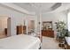 Bright bedroom with a four-poster bed, tray ceilings, and traditional furnishings at 4712 Bright Pebble Ct, Raleigh, NC 27604