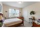 Inviting bedroom with natural light, neutral tones, and minimalist décor for a peaceful retreat at 4712 Bright Pebble Ct, Raleigh, NC 27604