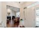 Welcoming foyer with hardwood floors, a view into the living room, and a bright white front door at 4712 Bright Pebble Ct, Raleigh, NC 27604
