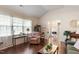 Sunlit living area with hardwood floors, vaulted ceiling, and inviting seating at 4712 Bright Pebble Ct, Raleigh, NC 27604