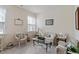 Charming living room featuring wicker furniture, neutral tones, and natural light at 4712 Bright Pebble Ct, Raleigh, NC 27604