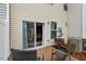 A charming patio with wicker furniture and a sliding glass door leading into the inviting home at 5 Galway Glenn Ln, Durham, NC 27705