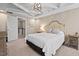 Bedroom featuring a unique wood headboard and neutral tones, creating a cozy and inviting atmosphere at 5 Galway Glenn Ln, Durham, NC 27705