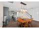 Open floor plan with dining area, kitchen, stairs, and hardwood floors at 5 Galway Glenn Ln, Durham, NC 27705