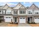 Charming townhomes with stone accents, attached garages and inviting curb appeal at 5 Galway Glenn Ln, Durham, NC 27705