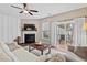 Open concept living room featuring a ceiling fan and sliding glass doors leading to outdoor space at 5 Galway Glenn Ln, Durham, NC 27705