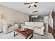 Spacious living room with hardwood floors, lots of natural light, adjacent kitchen, and stairs at 5 Galway Glenn Ln, Durham, NC 27705