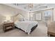 The primary bedroom has a tray ceiling, windows, and carpet flooring at 5 Galway Glenn Ln, Durham, NC 27705