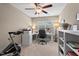 Office with a built-in desk and ceiling fan, designed to maximize productivity and comfort for a perfect work environment at 5 Galway Glenn Ln, Durham, NC 27705