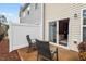 Back patio with privacy fence and outdoor seating area at 5 Galway Glenn Ln, Durham, NC 27705