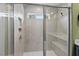 A glass enclosed shower with bench seating and a window for natural light at 5 Galway Glenn Ln, Durham, NC 27705