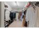 Spacious walk-in closet with clothing racks and shelving providing ample storage space for an organized wardrobe at 5 Galway Glenn Ln, Durham, NC 27705