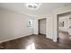 Bedroom with wood floors, a large closet, and a large window with backyard views at 5013 Green Oak Dr, Durham, NC 27712