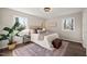 Calm bedroom filled with natural light from large window and hardwood floors at 5013 Green Oak Dr, Durham, NC 27712