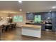 Open concept kitchen and dining room with hardwood floors and stainless steel appliances at 5013 Green Oak Dr, Durham, NC 27712