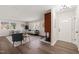 Bright living room features a decorative brick fireplace and hardwood floors at 5013 Green Oak Dr, Durham, NC 27712