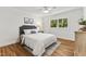 Comfortable bedroom with a ceiling fan, window views, and a neutral color scheme at 506 N Greensboro St # Apt 33, Carrboro, NC 27510