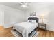 Comfortable bedroom with a ceiling fan, neutral decor, and a soothing color palette at 506 N Greensboro St # Apt 33, Carrboro, NC 27510