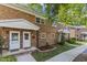 Charming brick townhomes with well-maintained lawns and landscaped front yards create curb appeal at 506 N Greensboro St # Apt 33, Carrboro, NC 27510