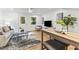 Inviting living space with hardwood floors, stylish furniture, and ample natural light at 506 N Greensboro St # Apt 33, Carrboro, NC 27510