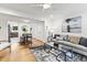 Spacious living room with hardwood floors, contemporary furnishings, and an open layout at 506 N Greensboro St # Apt 33, Carrboro, NC 27510