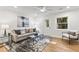 Cozy living room with a comfortable sofa, stylish rug, and a door leading to the outside at 506 N Greensboro St # Apt 33, Carrboro, NC 27510
