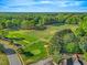 Breathtaking aerial view of a lush golf course with manicured greens at 5109 Windance Pl, Holly Springs, NC 27540