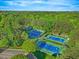 Scenic aerial view of the community's well-maintained tennis courts at 5109 Windance Pl, Holly Springs, NC 27540