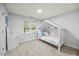 Cozy bedroom with unique house-shaped bed frame, neutral gray walls, and carpeted floor at 5109 Windance Pl, Holly Springs, NC 27540
